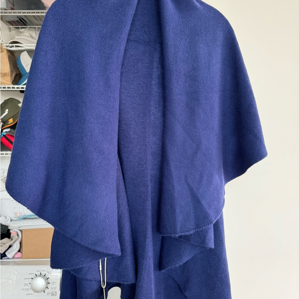 Blue sweater cape NWT. Never been worn. One size but prob best on S, M, L frame